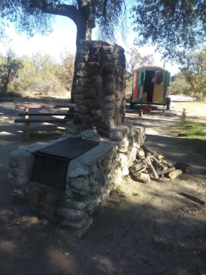 Oak Grove Campground. Vintage barbecue and pile of firewood.
