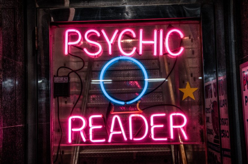 “turned on red Psychic Reader neon sign” by Scott Rodgerson on Unsplash