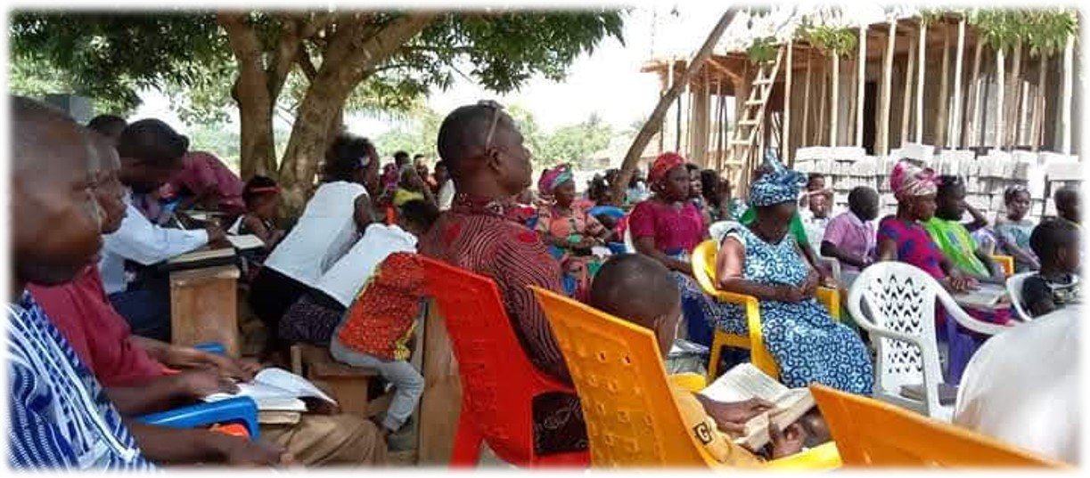 Guld Cof C meeting under a tree.jpg