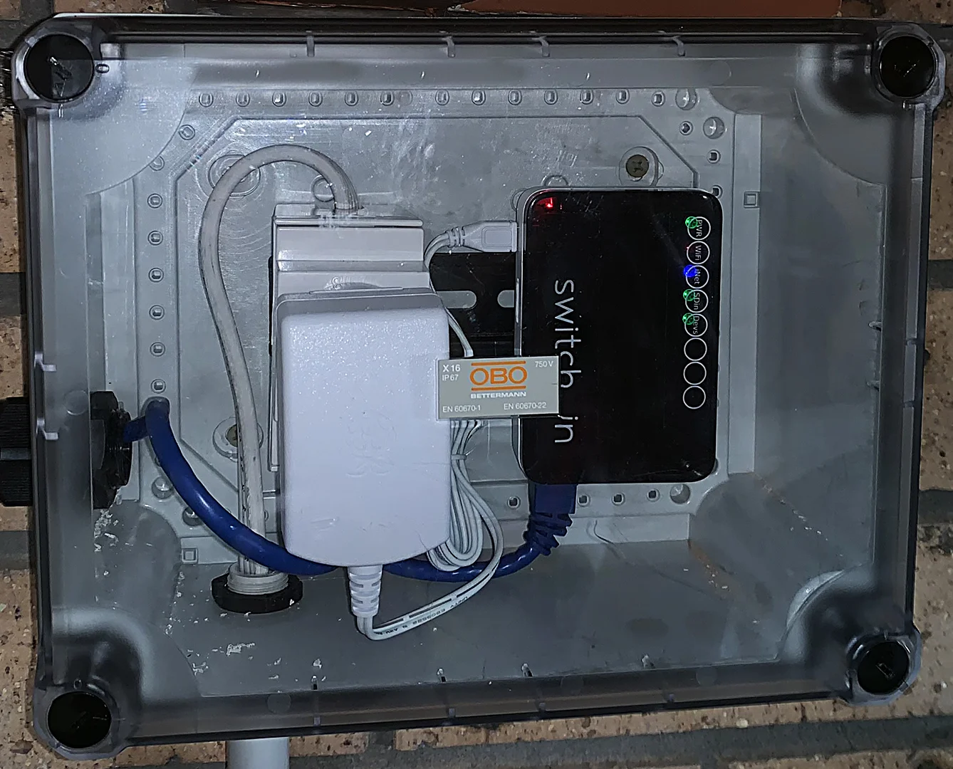 SwitchDin Droplet & power supply in a separate enclosure. The Droplet connects to the battery via an Ethernet cable.