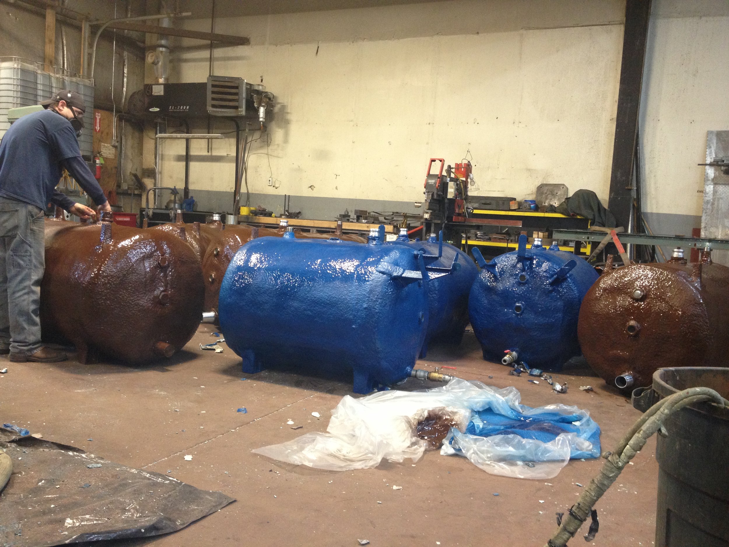  Urethane and polyshield applications for rural Alaska. The blue tanks are for fresh water usage while the brown tanks are for black water transportation. 