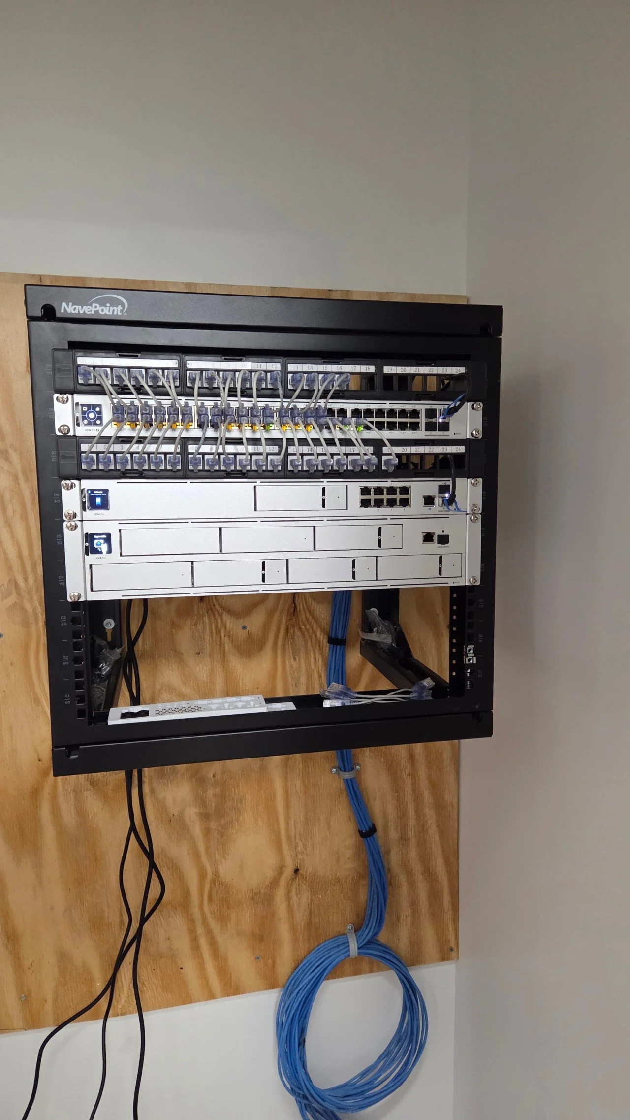 UniFi network rack installation with UDM Pro, USW Pro switch, and NVR Pro by Booker Electrical Services in Massachusetts