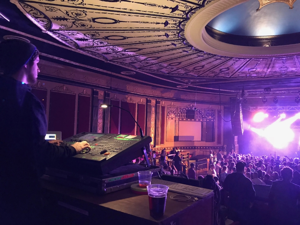 Matvey in action as lighting designer at Rapids Theater