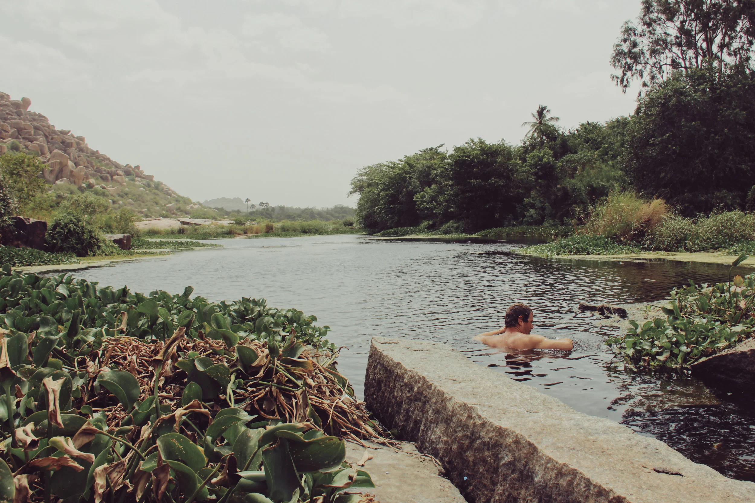 Taking a dip in the Tungabhadra River in Hampi.