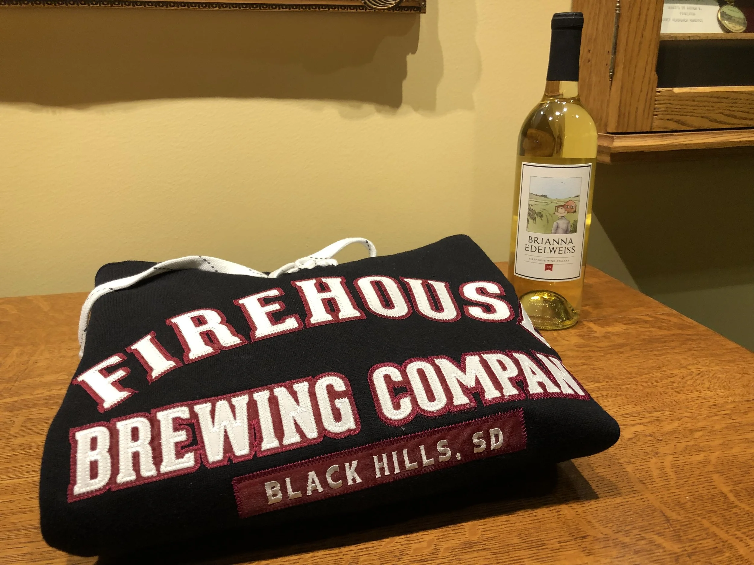 Firehouse Brewering Company woman’s hoodie (XXL) and bottle of Brianna Edelweiss wine from Rapid City, South Dakota