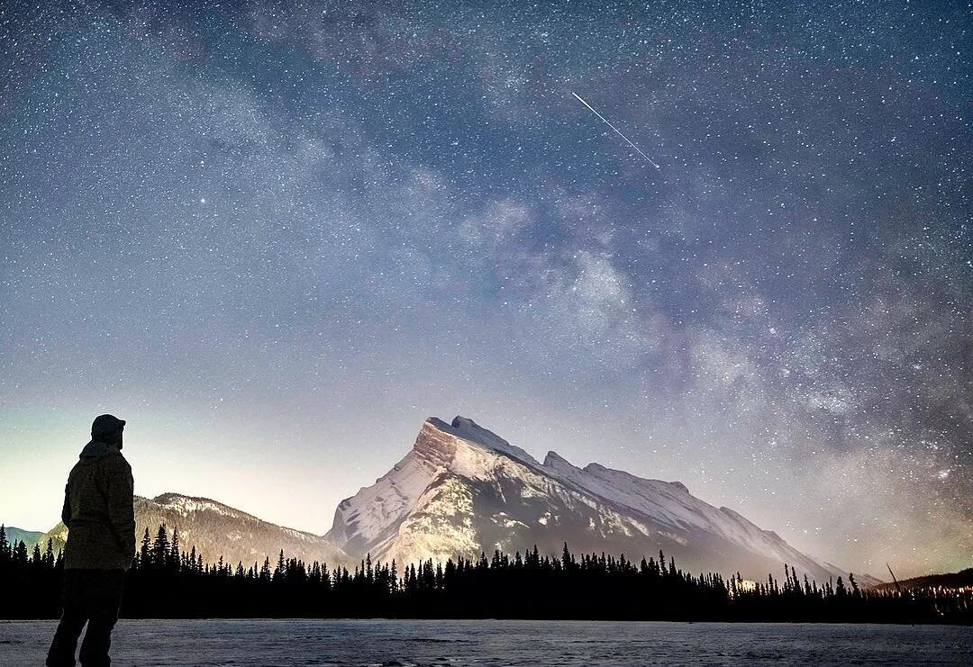 It was a such an amazing view standing on the frozen Vermilion Lake with the lights of Banff bouncing off Mt. Rundle. I worked pretty hard to pull this shot off as it took three trips to Canada to get clear skies. It was -33&deg;F this night and prob