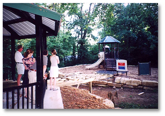 Neighbors view construction of the bridge connecting the Play Area with the Pavilion.