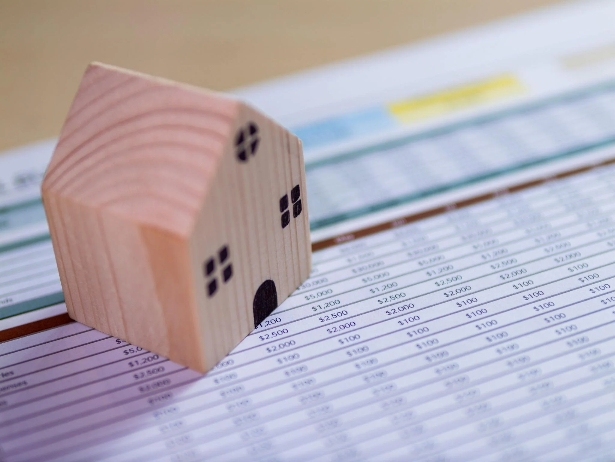 Real estate agent explaining home pricing strategy to seller using market data