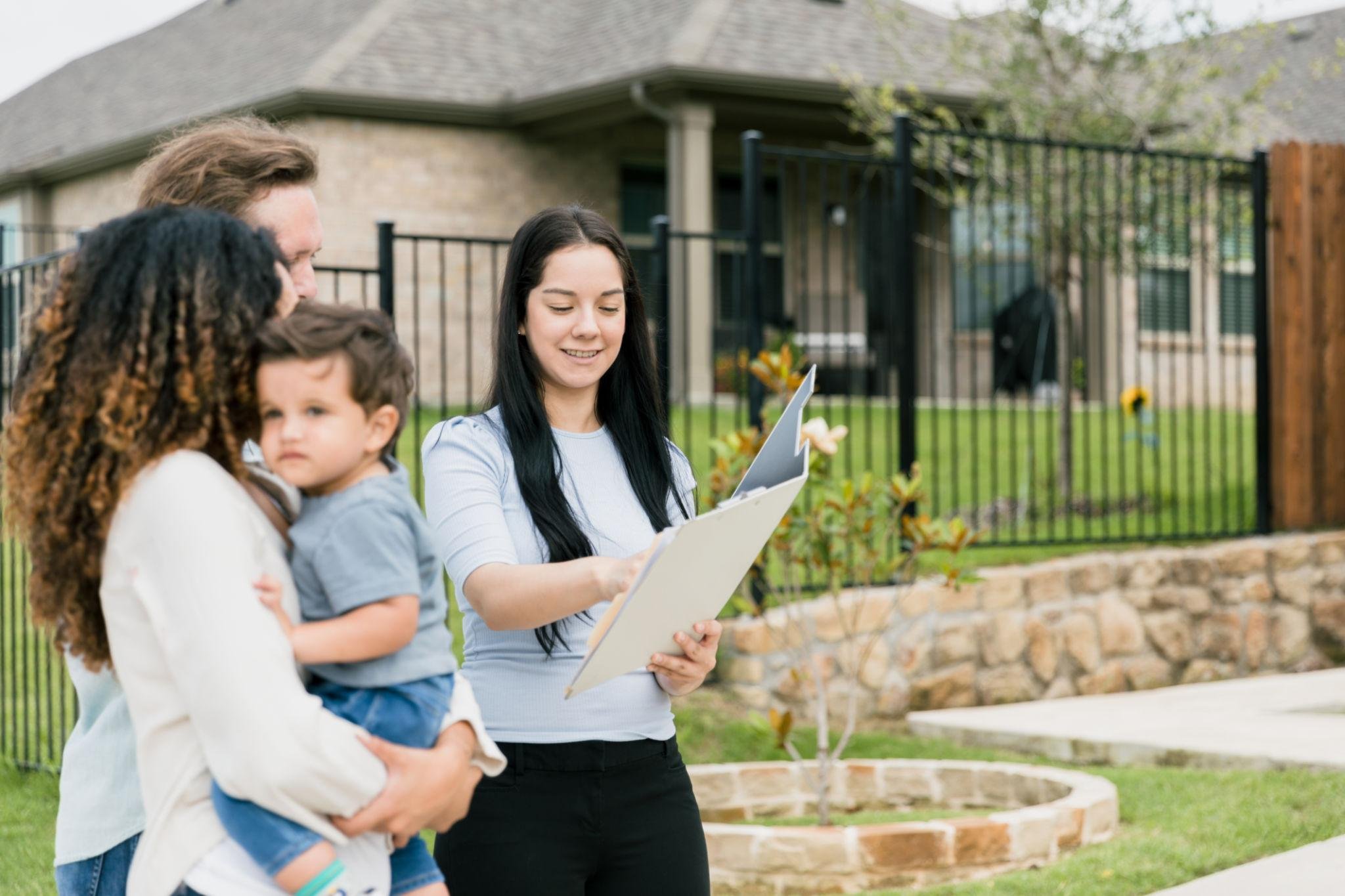 Home buyers reacting positively while touring a well-presented property