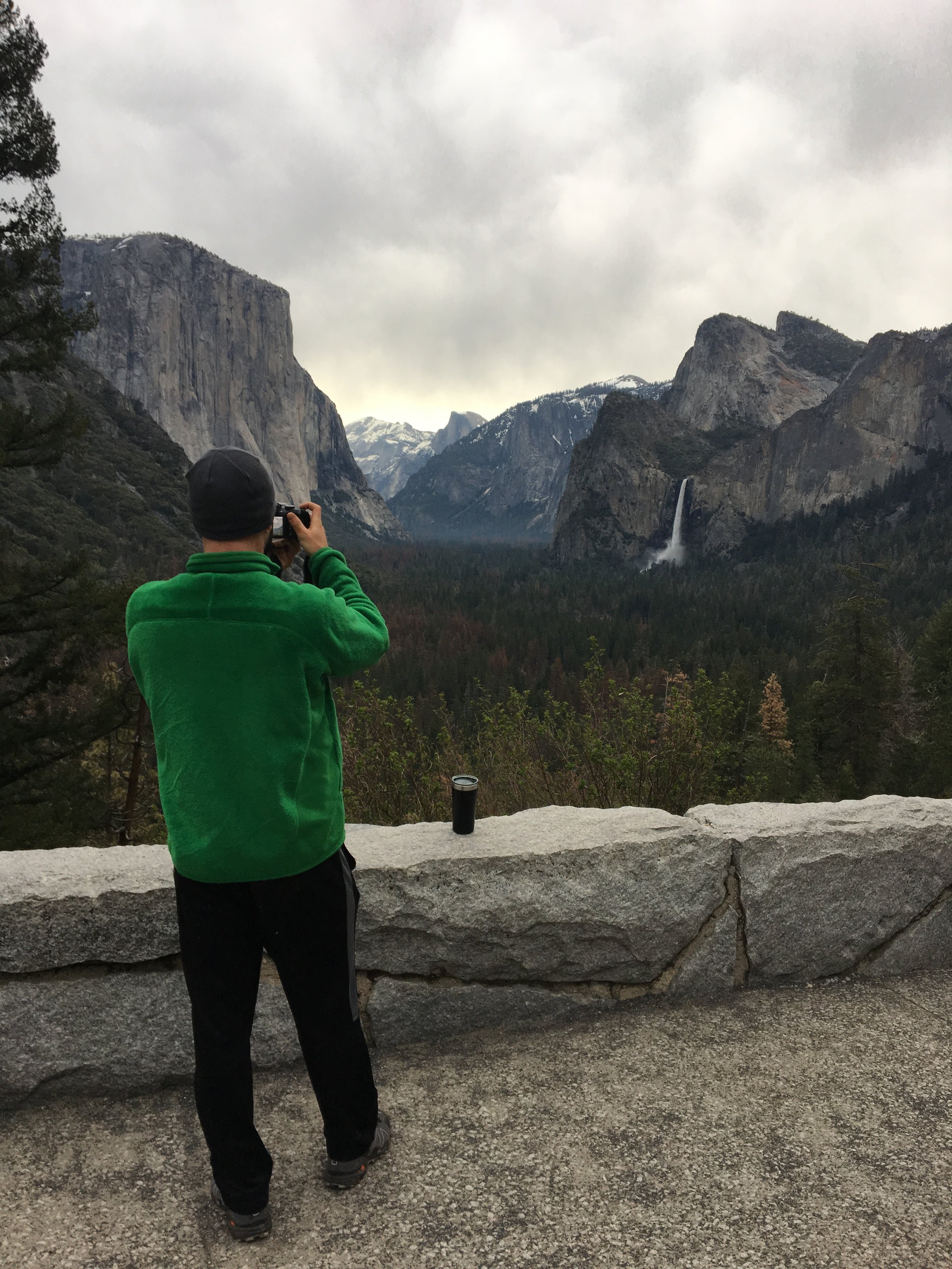  My handsome photographer in his ugly green jacket (which I have dubbed “The Grinch”) photographing Tunnel View 