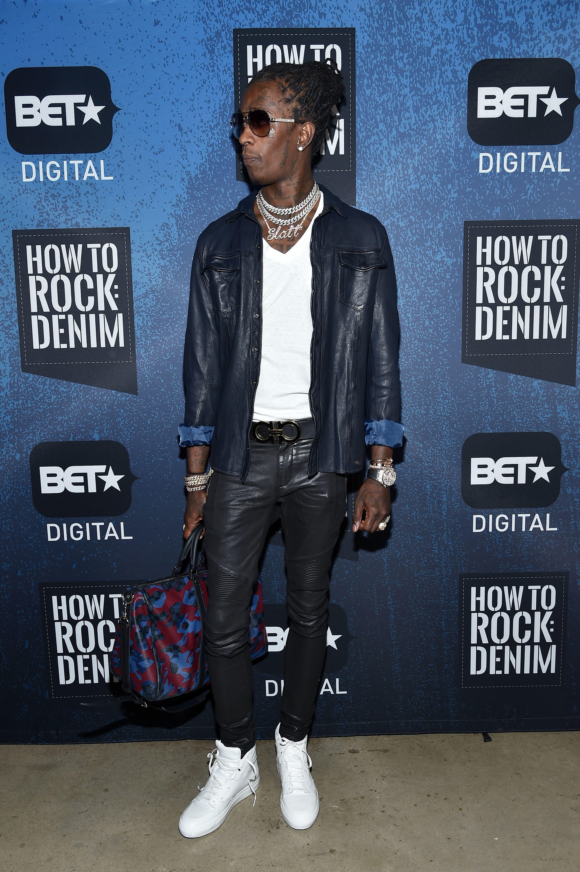 Young Thug sporting a purse.