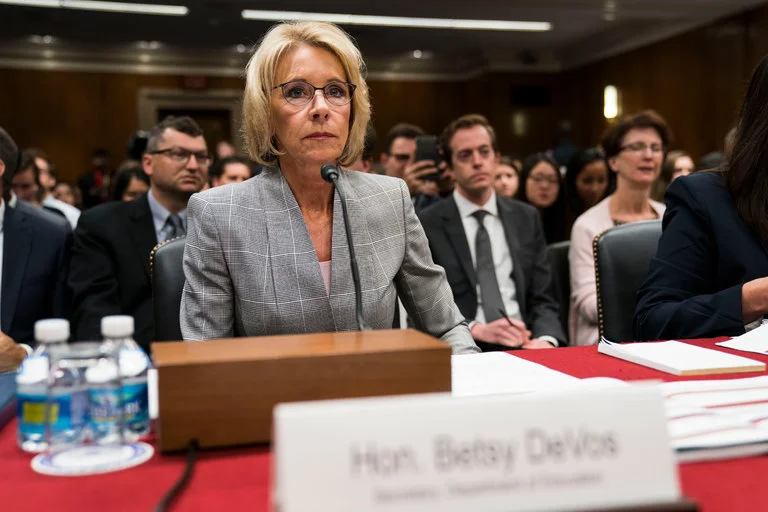 Devos, photo via Getty Images