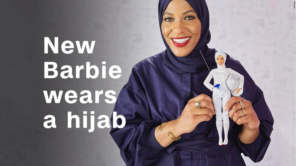 Muhammad pictured with the new Barbie, photo via CNN Money