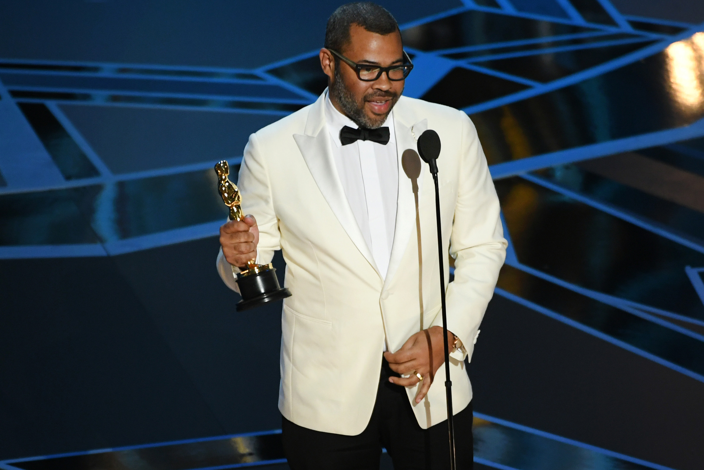 Jordan Peele accepting his Oscar, photo via NBC