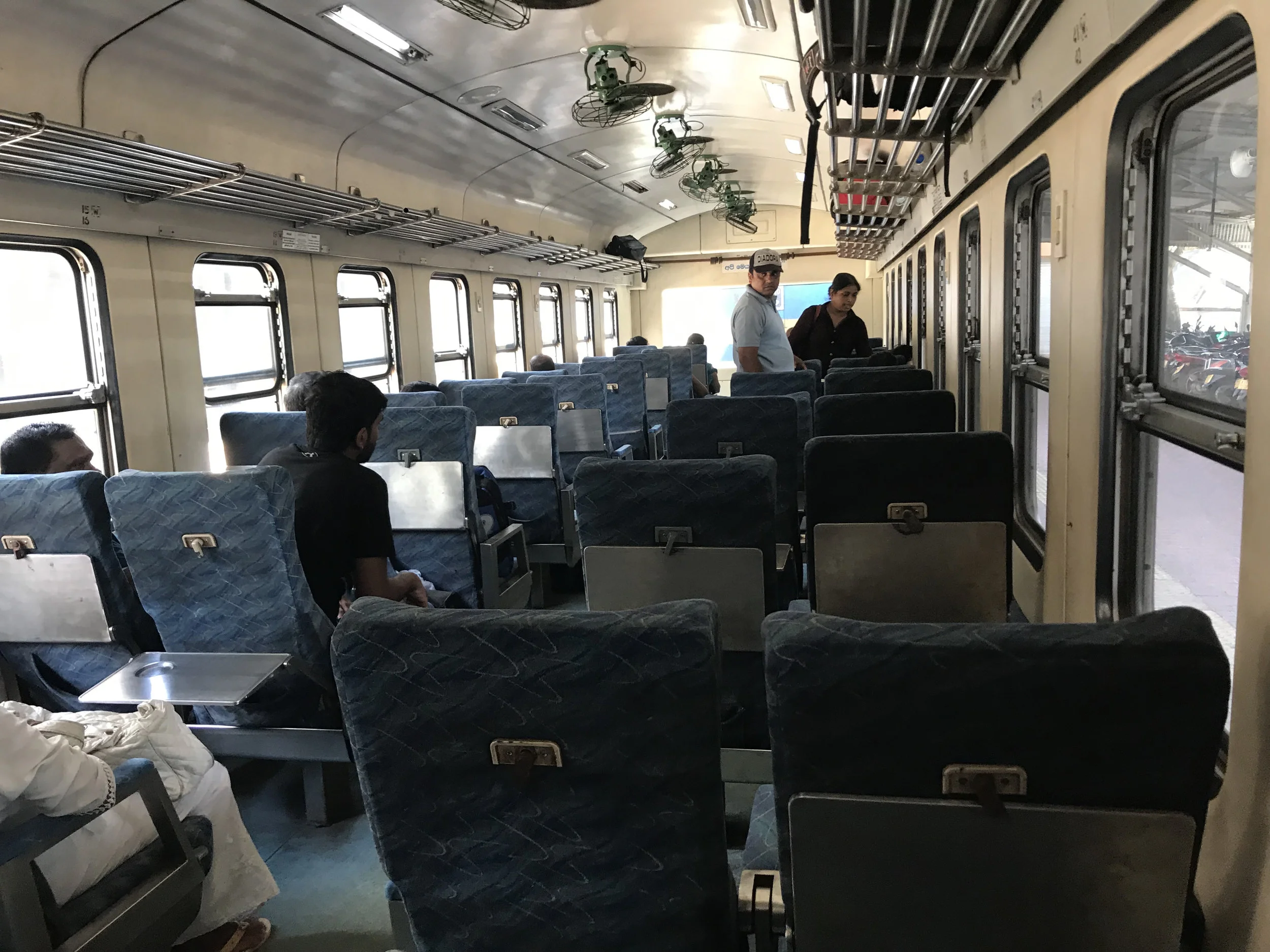 A view from my seat on the train to Colombo. In one of the first-class cabins, there’s much more leg room than on a typical passenger plane. Fans above help cool down the space, but virtually every window was open on the journey.