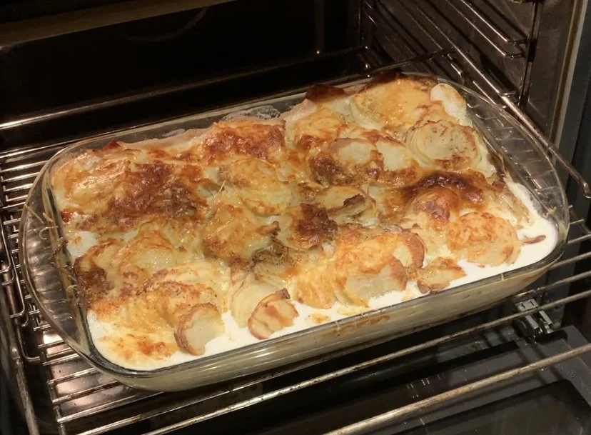 Roasted sliced potatoes with onions, garlic and gruyère.