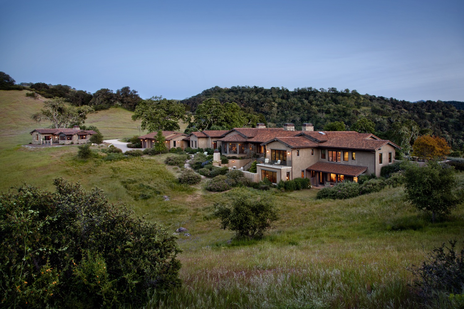 The back of the home and guesthouse, photographed from a hill.