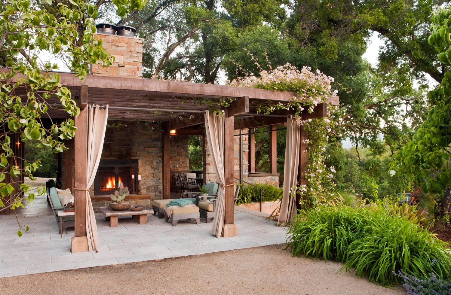 The pool house has a shaded porch and fireplace, providing a cool area during the day and warmth when it cools off at night.