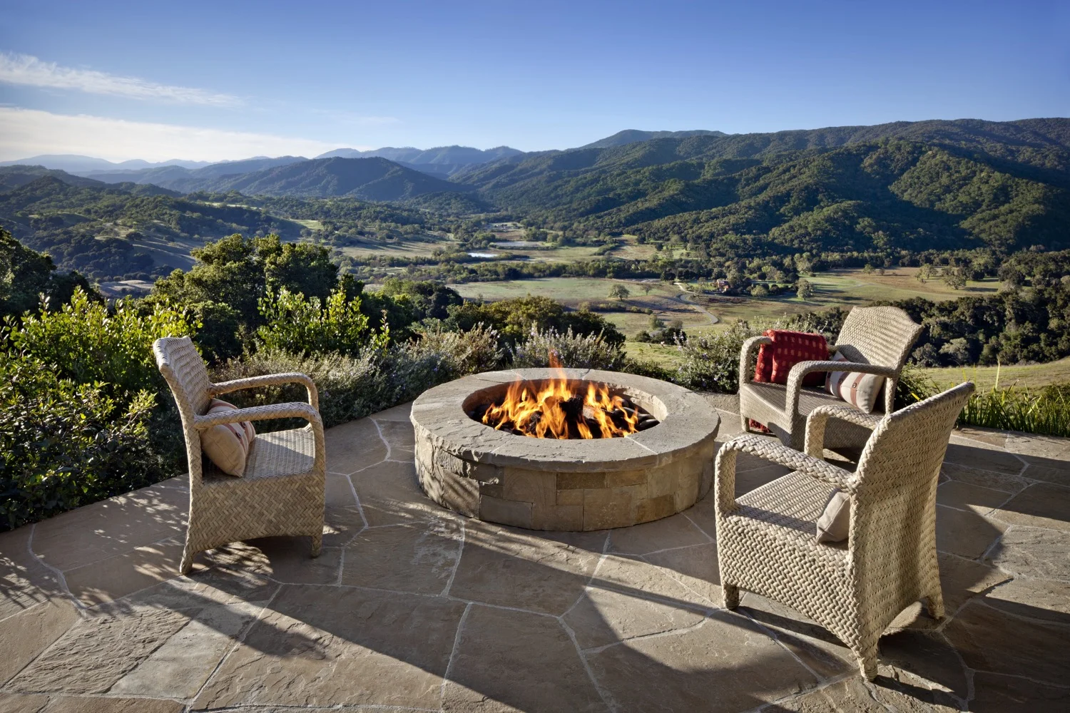 The firepit is close to the ridge, with sweeping views of the valleys below.