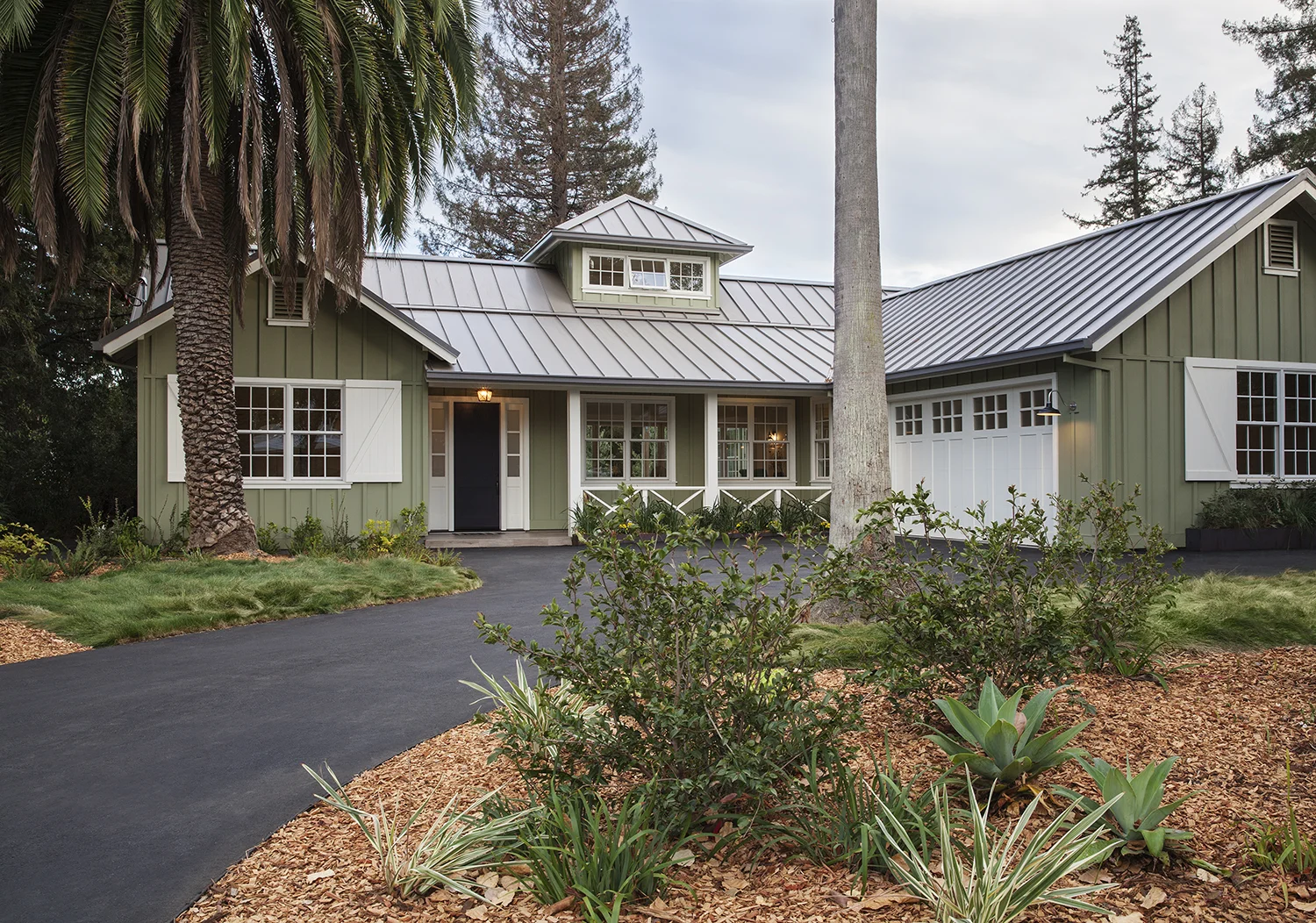 The contemporary agrarian architecture is welcoming from the front drive.