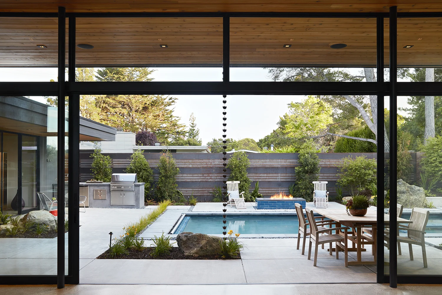 An overview of the courtyard, showing rainchains that direct water off of the large overhanging eaves.