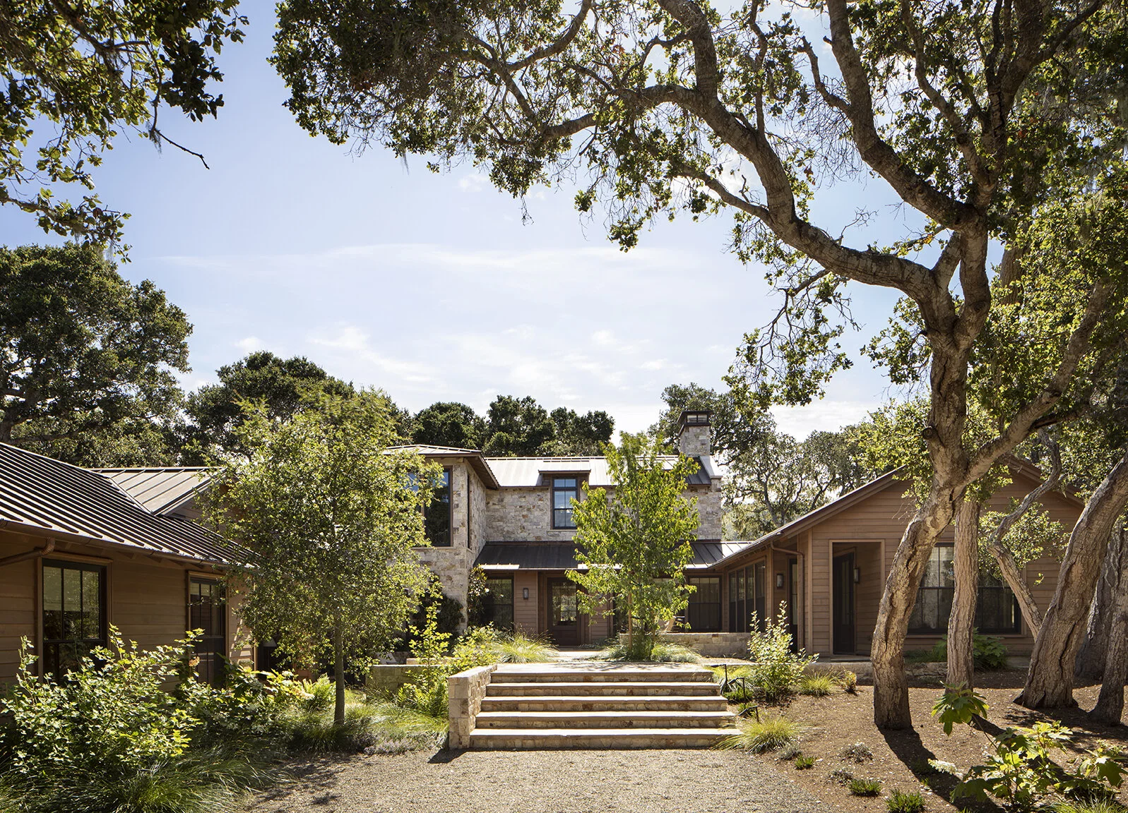 The pool reflects the blue sky, and the firepit was made from a reclaimed sugar bowl.
