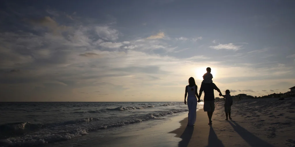 Family walking beach.jpeg