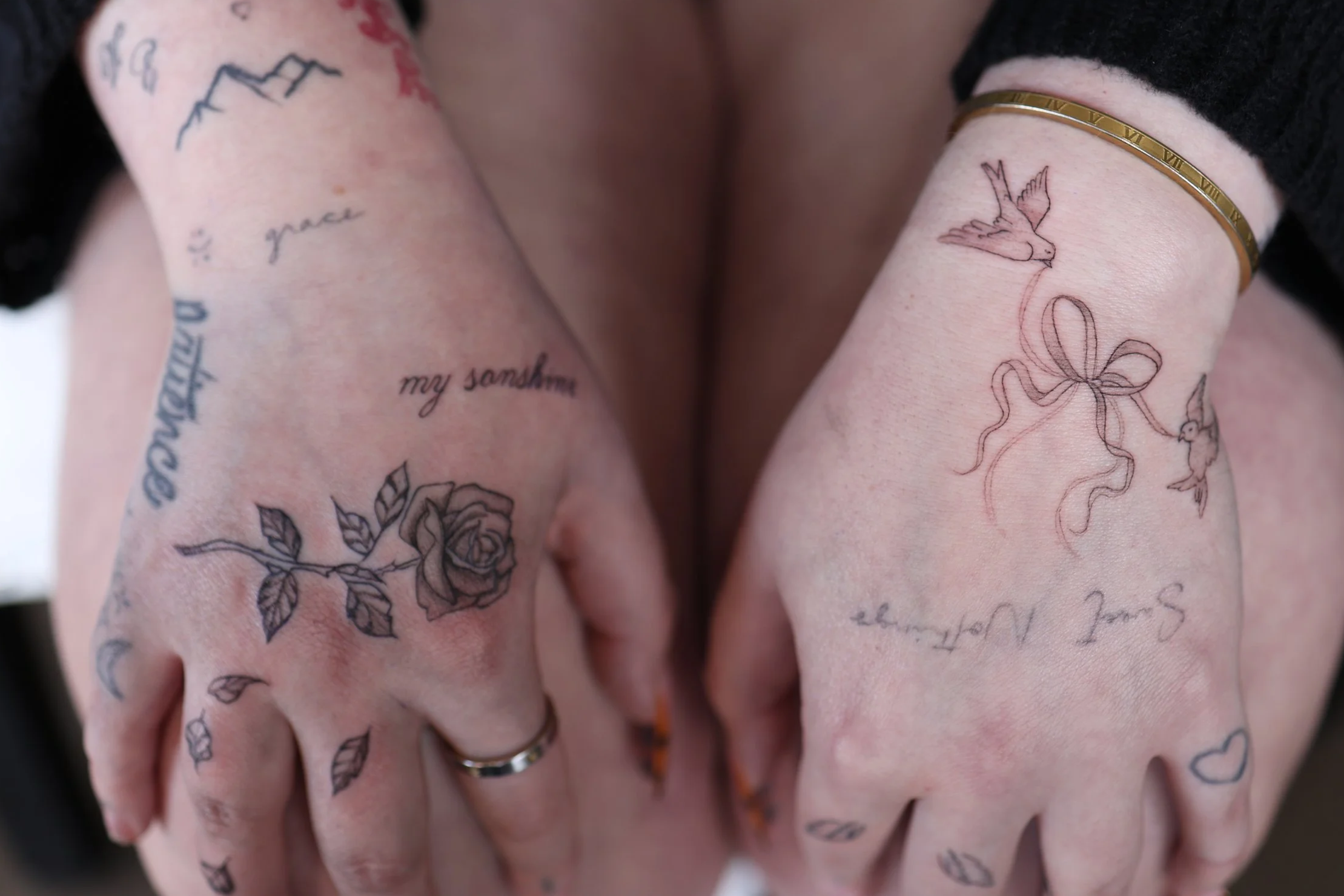 book tattoos and piercings, ear curations, fineline tattoos