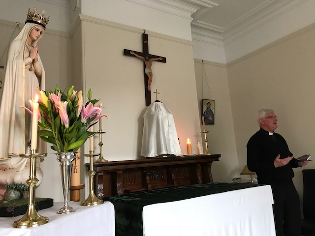 Fr Gerard Ryan speaks to the community about devotion to Our Lady.