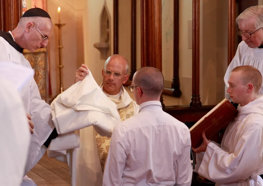 Preparing to clothe Brother Gregory.