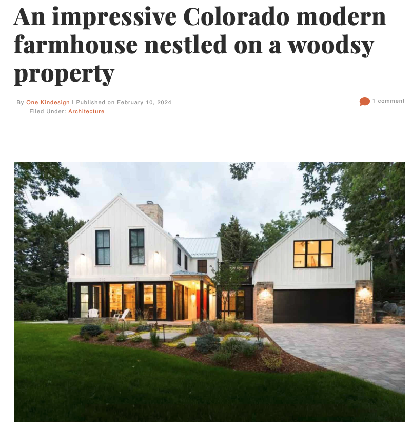 Saltwolf designed modern farmhouse with white exterior, black accents, large glass windows, and a two-car garage, set on a wooded property with a landscaped lawn in an article from One Kind Design.