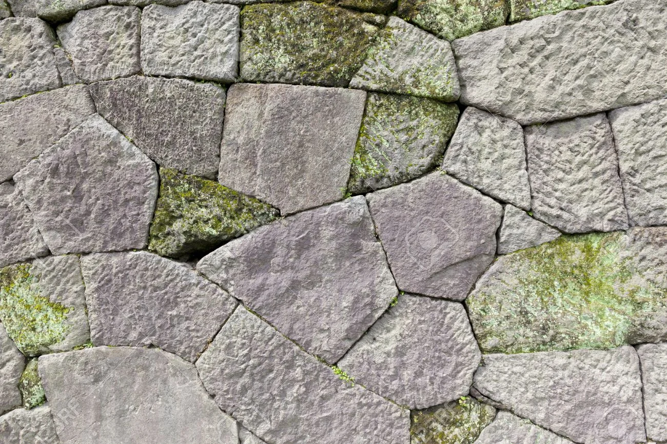 17938673-Close-up-of-the-stone-wall-of-a-traditional-Japanese-castle--Stock-Photo.jpg