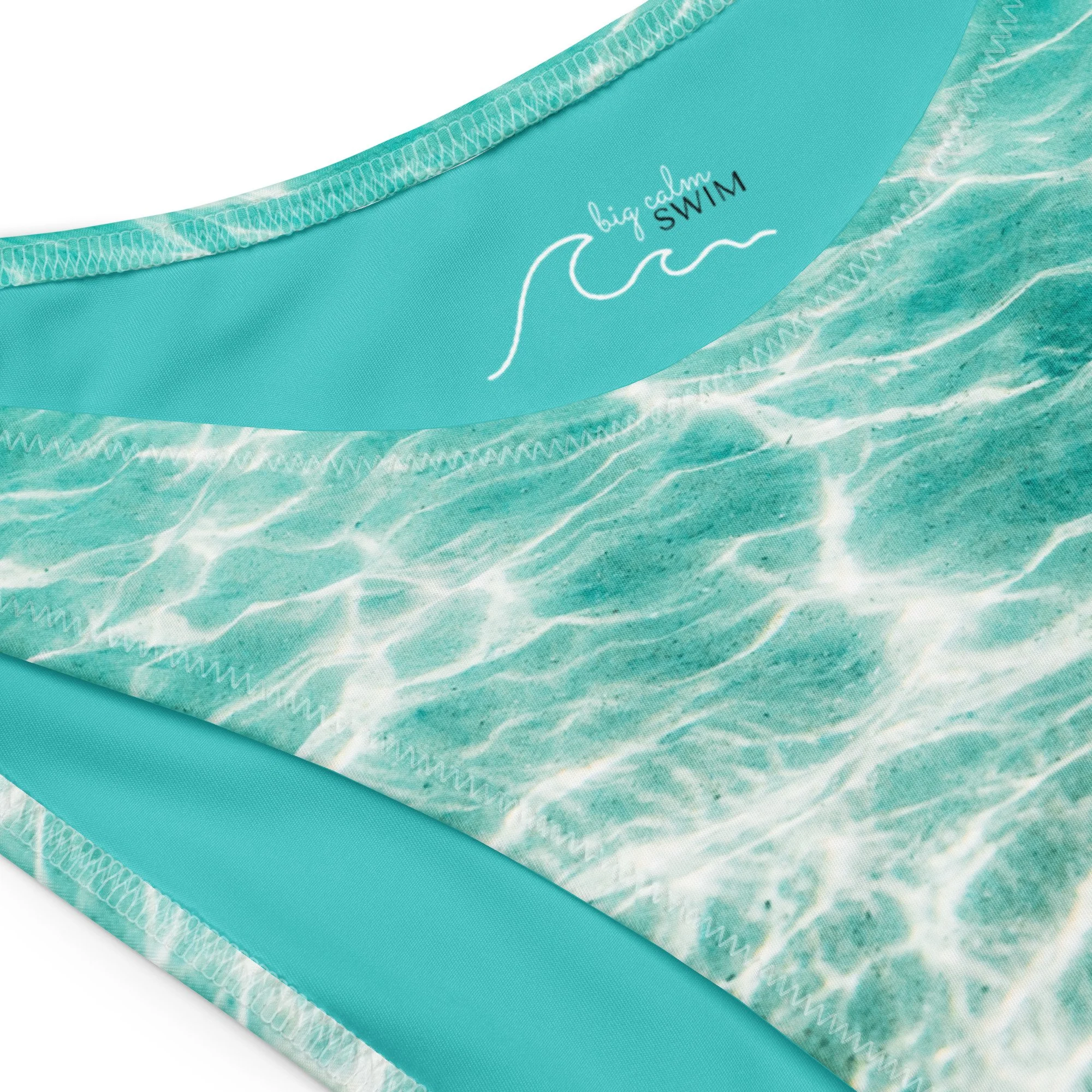 all-over-print-recycled-v-cut-bikini-bottom-white-product-details-69dedac5cc969.jpg