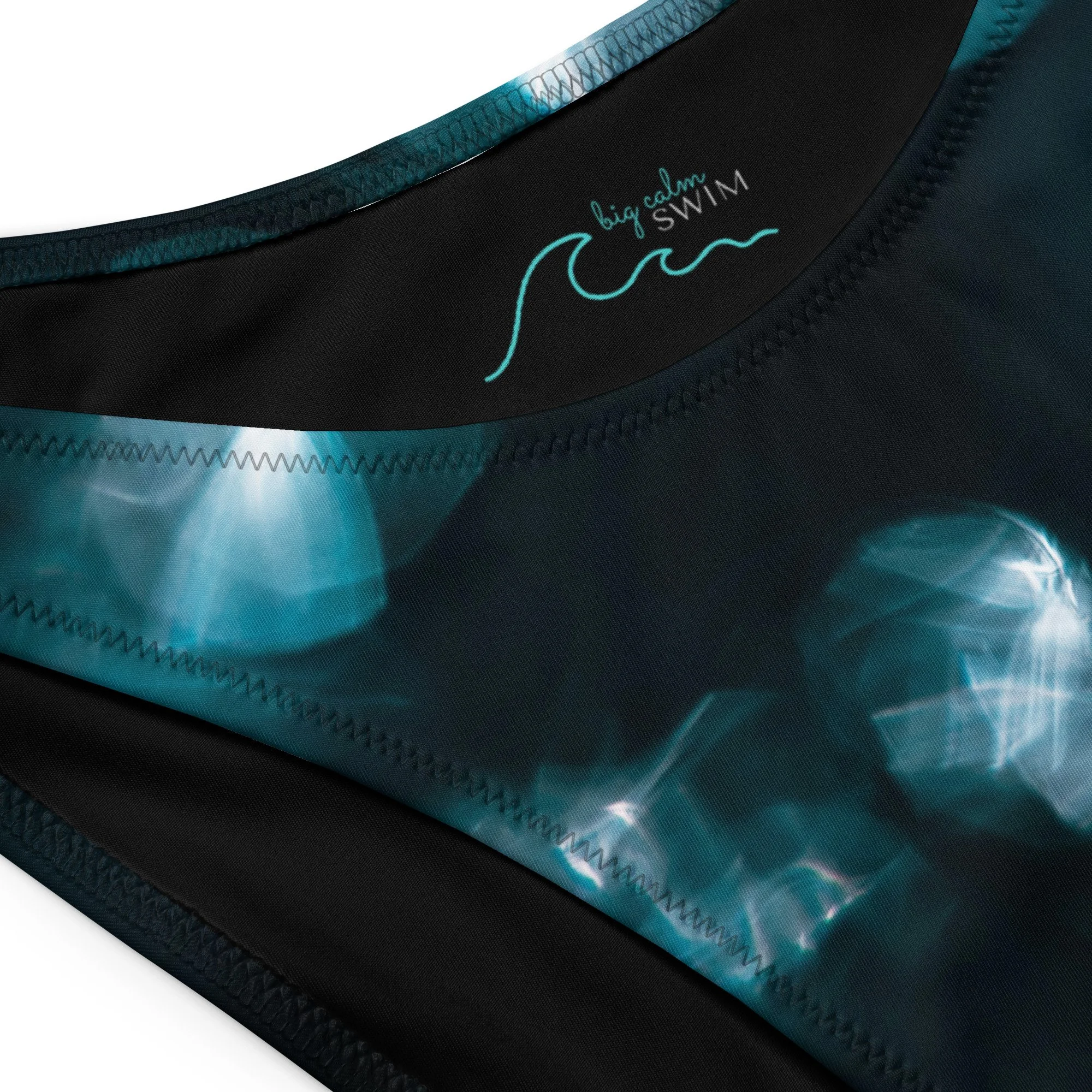 all-over-print-recycled-v-cut-bikini-bottom-white-product-details-69deedbc88465.jpg