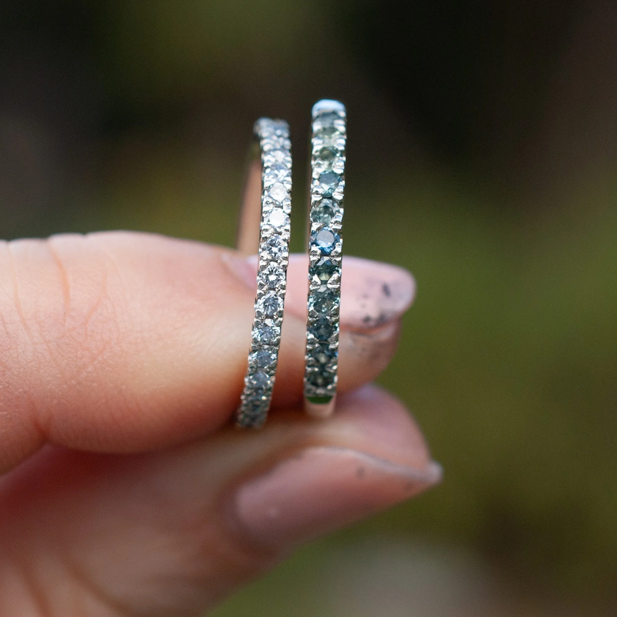 Grain-set-teal-sapphire-ring-by-Susan-McGinness-held.jpg