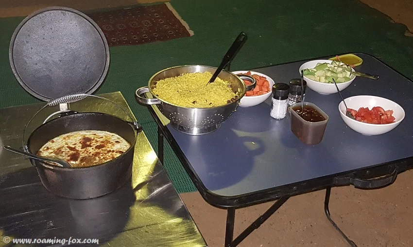 Delicious campfire bobotie, yellow rice and accompaniments made by Duncan and Beres