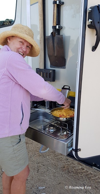 Sue cooking an omelette