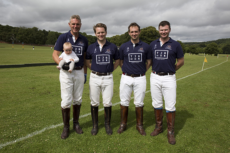 The TJB HAC Polo (Regimental) Team and polo ball sized fan on a rare sunny moment.