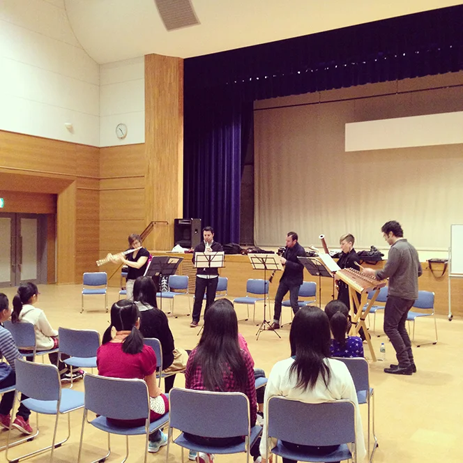 The band performs for the young composers ( via Instagram )