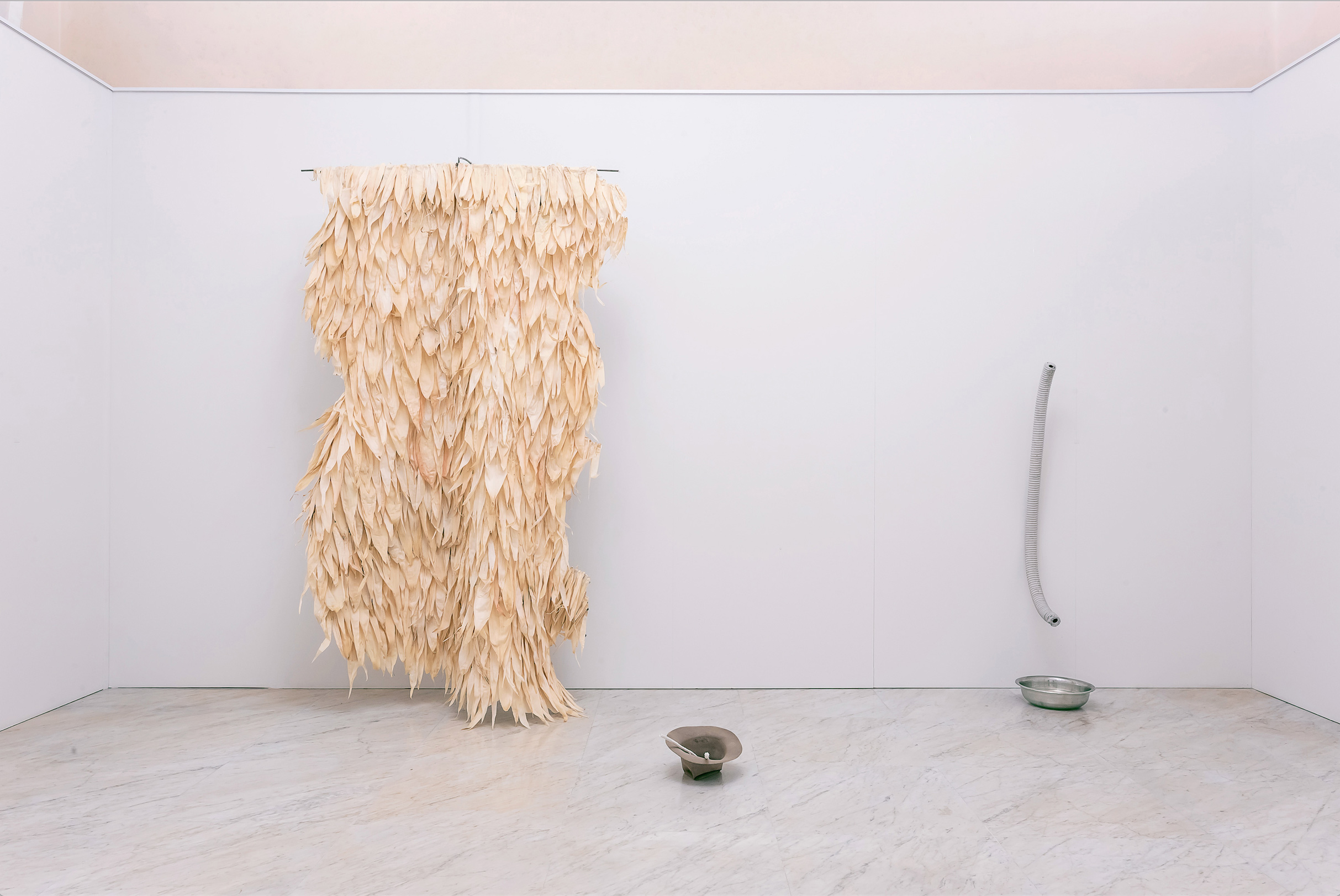   Excavata , Corn husks on a leather cape, installation view, Carrara 2016 