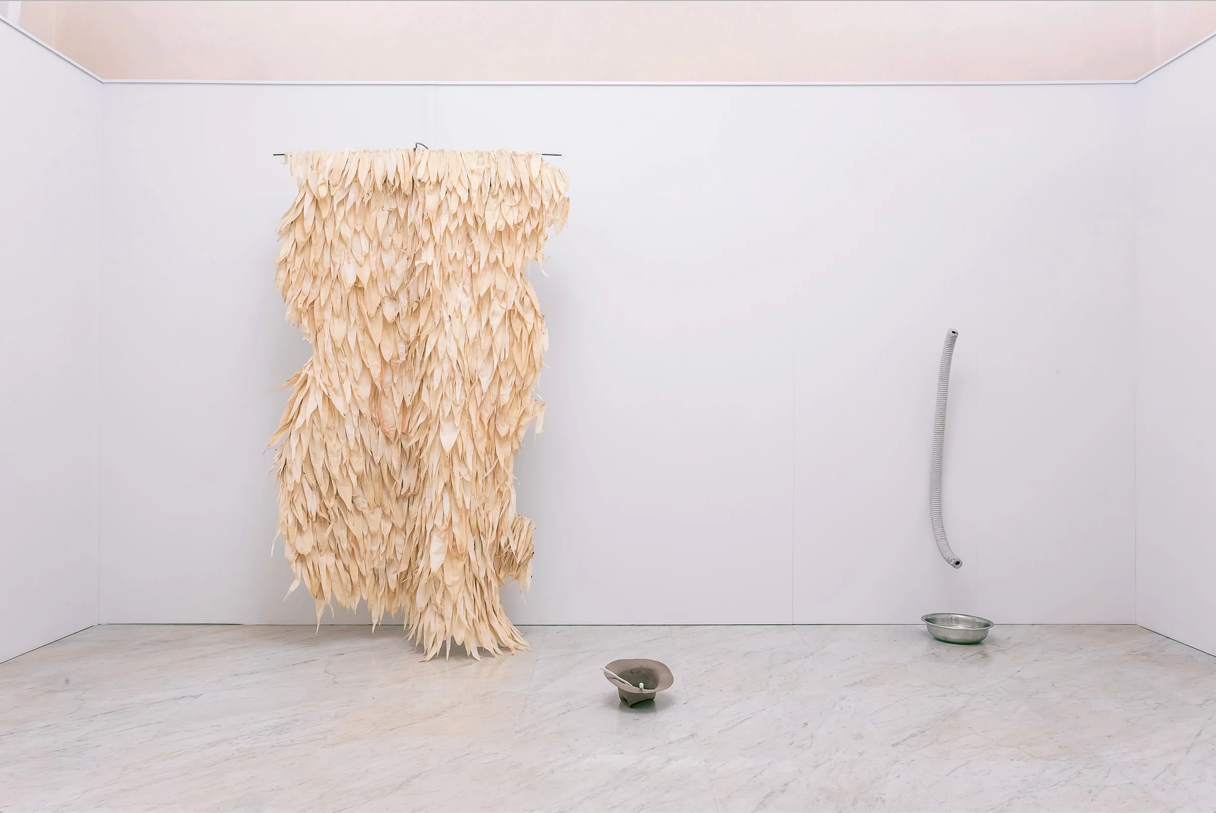 Excavata , Corn husks on a leather cape, installation view, Carrara 2016