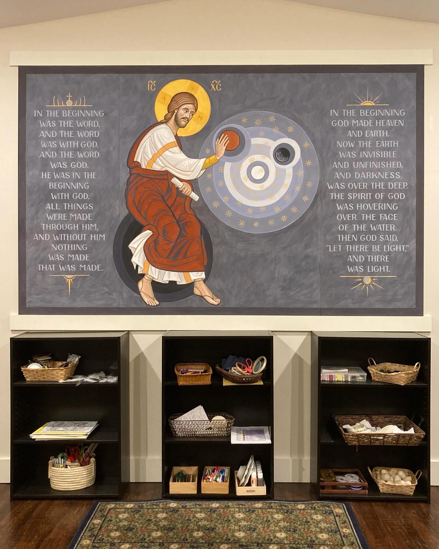 This mural of the pre-incarnate Word of God creating the heavenly bodies is just about complete. It lives in a classroom for 9-12 year olds, and is directly opposite a mural of the Heavenly Jerusalem. The choice of these two compositions was made to 