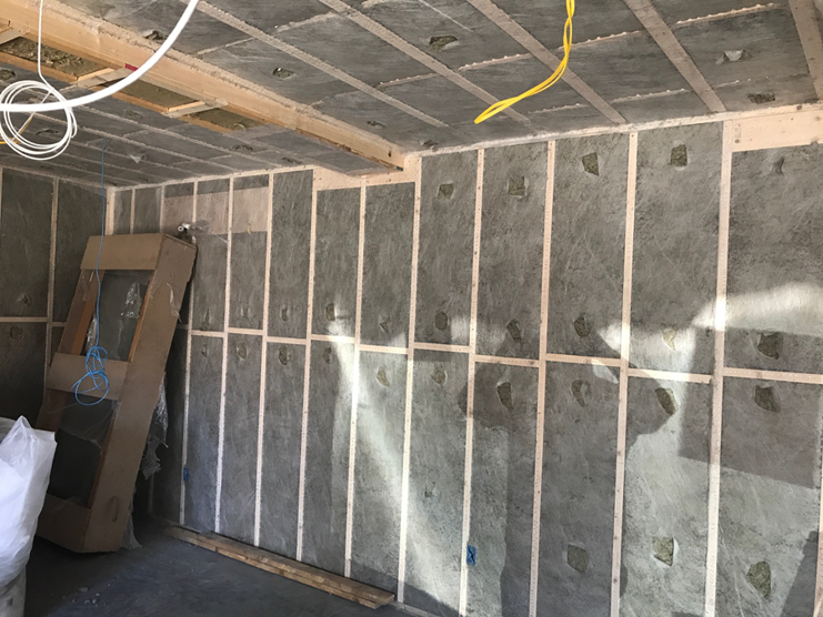 Dense-packed cellulose insulation blown into cavities