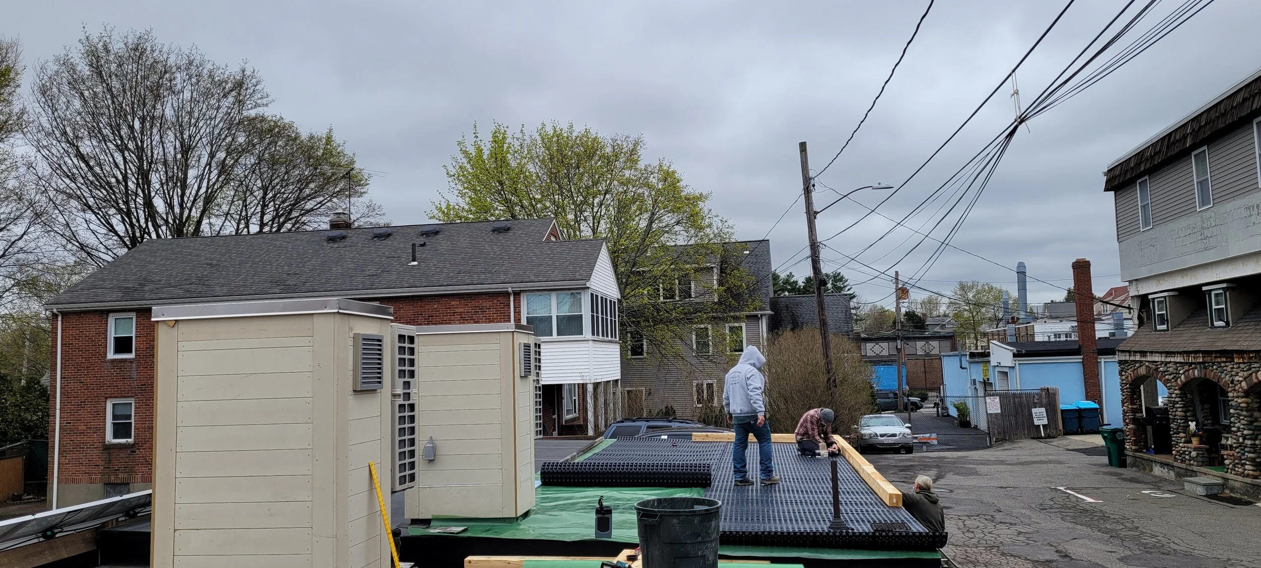 Waterproofing layers and other membranes getting put on the roof to support the garden