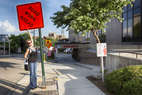 Whatever it takes: an art director will even move road signs out of the line of vision to get the perfect shot of a building. (Photo: Sheri Oneal Photography)