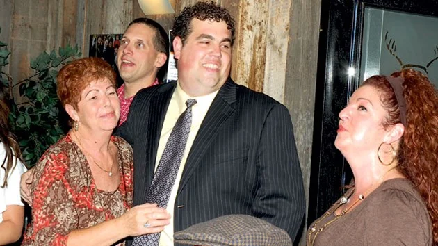 With his arm around his mother, Franca, while he smiles at his sister, Sabrina Cimino, Ward 8 Coun. Fabio Belli celebrates his election win in 2010. The 37-year-old popular city councillor died suddenly in Florida on April 12 from an apparent heart attack. File photo.