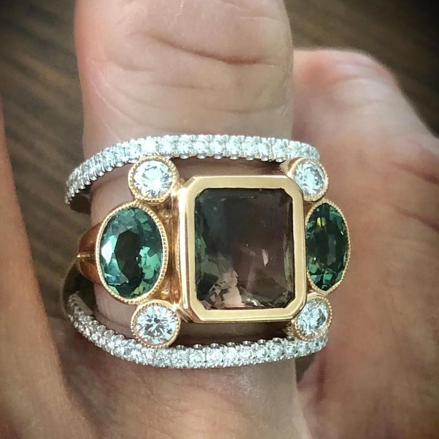 Repost @lynnemerceinfinejewelry 
This ring trio of diamonds, tourmaline and sunstone is the perfect mix to compliment any holiday attire.  Square diamond bands sold separately.
*
*
*
*
*
#holidaybling #tourmaline #bluegreentourmaline #diamondjewelry 