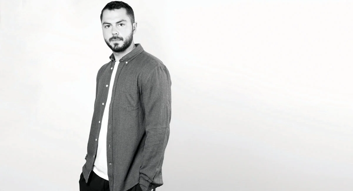 Portrait of Apostol Kardamov, founder of Kardamov Studio, standing in a minimal studio setting