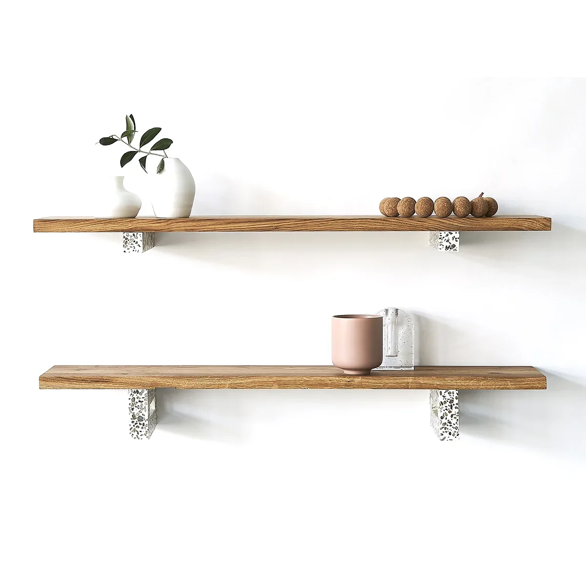 Hangul minimalist floating shelves featuring terrazzo brackets and natural oak wood, styled with ceramic vases and decor.