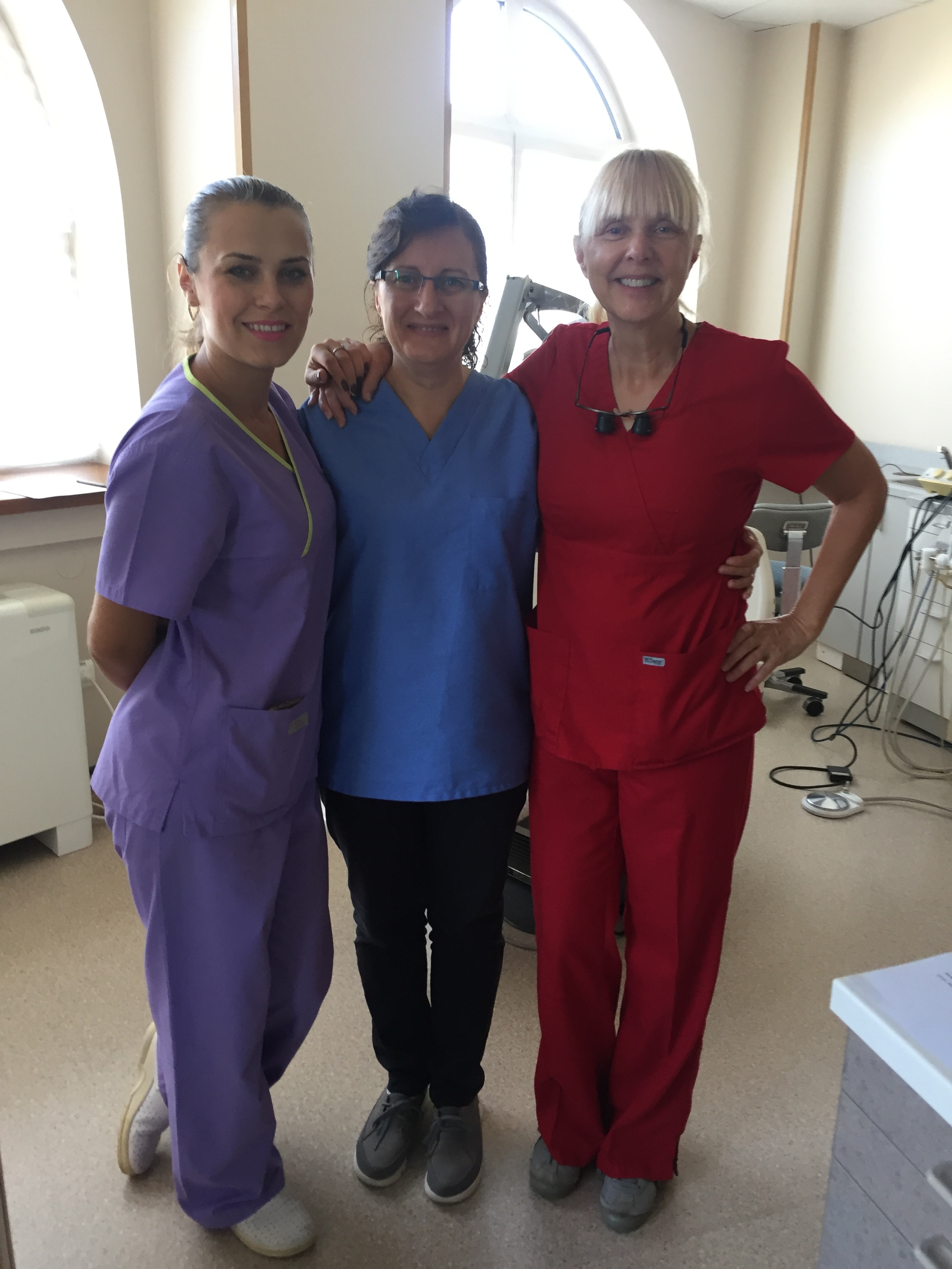 Dr. Beth Vance (red) & her Romanian dental team.JPG